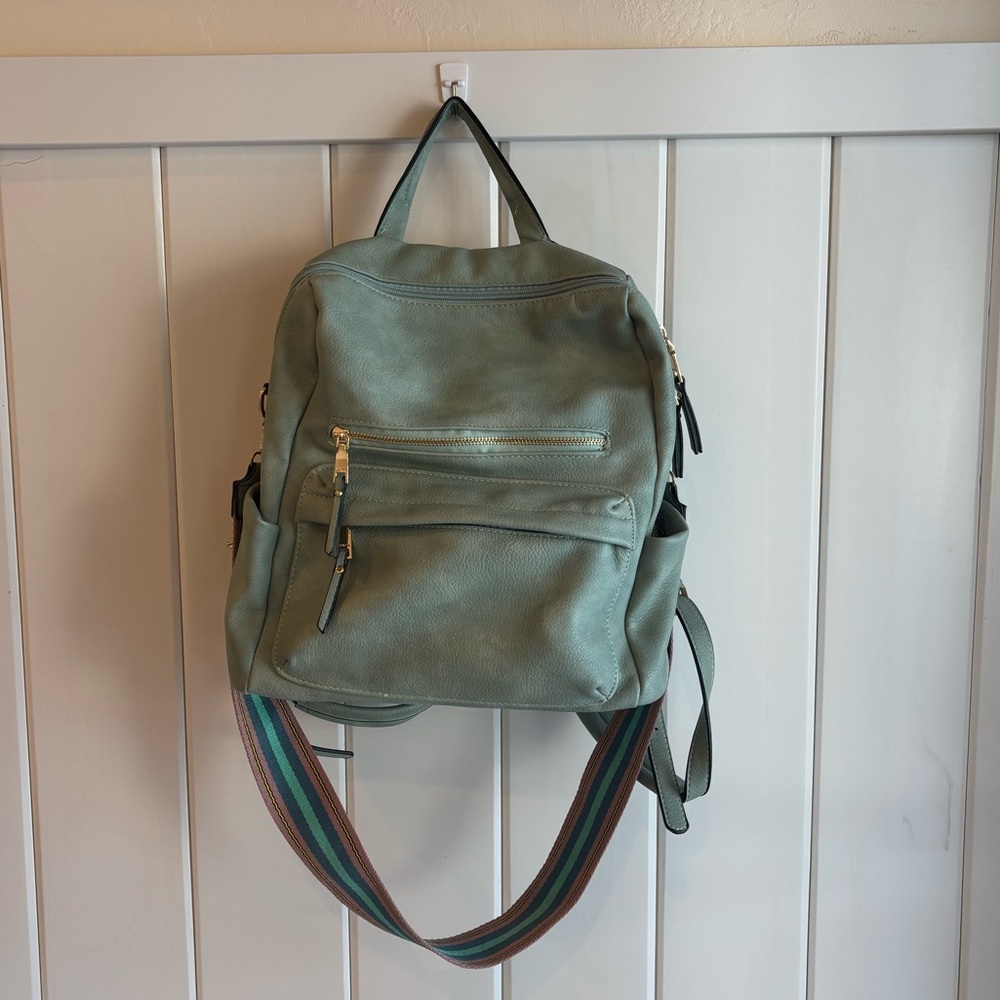Stylish Green Backpack with Multicolor Strap